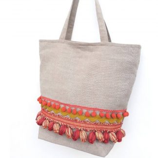Bolso de tela beige con pompones